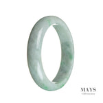 A close-up image of an authentic Grade A Burmese jade bangle bracelet. The bracelet features a beautiful green color with white accents and has a half moon shape. It measures 58mm in diameter. Perfect for adding a touch of elegance to any outfit.