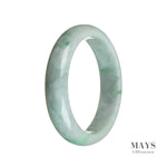 A close-up image of a beautiful green and white jadeite bangle bracelet. The bracelet is made from untreated jadeite, showcasing its natural and authentic beauty. The bangle features a half moon shape and has a diameter of 58mm. Perfect for adding a touch of elegance to any outfit.