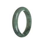 A close-up image of a real untreated green jadeite bangle bracelet. The bracelet is semi-round in shape and measures 59mm in diameter. The vibrant green color of the jadeite is showcased, highlighting its natural beauty. The bracelet is from MAYS GEMS.