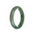 A close-up photo of a beautiful green jade bracelet with a semi-round shape. The bracelet is made of genuine grade A jade and measures 57mm in diameter. The natural green color of the jade shines brightly, giving the bracelet an elegant and luxurious look. The brand name "MAYS™" is engraved on the clasp.