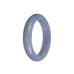 A close-up image of a beautiful lavender jade bangle bracelet, with a smooth oval shape and a Grade A certification. The bracelet has a rich, intense color that exudes a sense of elegance and luxury. Perfect for those who appreciate the beauty of natural gemstones.