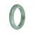 A beautiful light green Burma Jade bracelet with a semi-round shape, measuring 60mm in size. The bracelet is made of genuine and natural jade, showcasing its exquisite beauty. Perfect for adding a touch of elegance to any outfit.