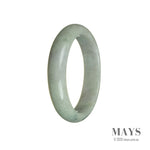 A close-up of a half moon-shaped jade bangle bracelet in vibrant green with hints of lavender, crafted with authentic Grade A jade from Burma.