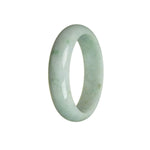 An elegant half-moon shaped white and green jadeite bangle, untreated and authentic.