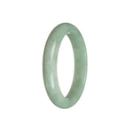 A half moon shaped green jadeite bracelet, showcasing the natural beauty and authenticity of the stone.
