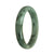 A half-moon shaped green jade bracelet, certified as untreated, with a diameter of 76mm, from MAYS GEMS.