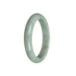 A beautiful half-moon shaped green jadeite bracelet, certified as 100% natural. The bracelet has a diameter of 59mm and is handcrafted by MAYS.