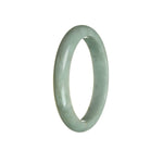 A stunning half moon shaped bangle bracelet made from genuine natural bluish green Burmese jade, measuring 59mm in size. A beautiful piece from MAYS GEMS.