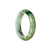 An elegant green and white Jade bangle bracelet with a unique brown pattern, showcasing its authenticity. The bracelet has a semi-round shape and measures 55mm in diameter. A stunning accessory from MAYS.