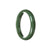 A half moon-shaped, untreated deep green Burma Jade bangle bracelet, measuring 57mm.
