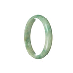 A beautiful light green flower jadeite jade bangle with a half moon shape, measuring 57mm.