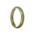 A close-up image of a certified Type A brownish olive green Burmese Jade bangle with a half moon shape, measuring 59mm in diameter. This high-quality jade bangle is from the MAYS™ collection.
