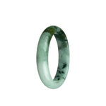 Close-up photo of a beautiful pale green and olive green Burma jade bangle with a half moon shape.