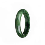 A close-up photo of a half moon-shaped green jade bracelet with a unique pattern.