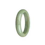 A half moon-shaped off white Burma jade bangle.