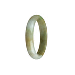A beautiful oval-shaped jadeite bangle with a natural, untreated yellowish brown color. The bangle features stunning white and green hues, adding a touch of elegance to any outfit. Measures 54mm in diameter. Created by MAYS.