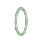A delicate light green Burma jade bracelet with a petite round design, perfect for adding a touch of elegance to any outfit.