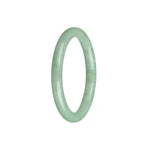 A small round light green Burmese jade bangle, untreated and natural.