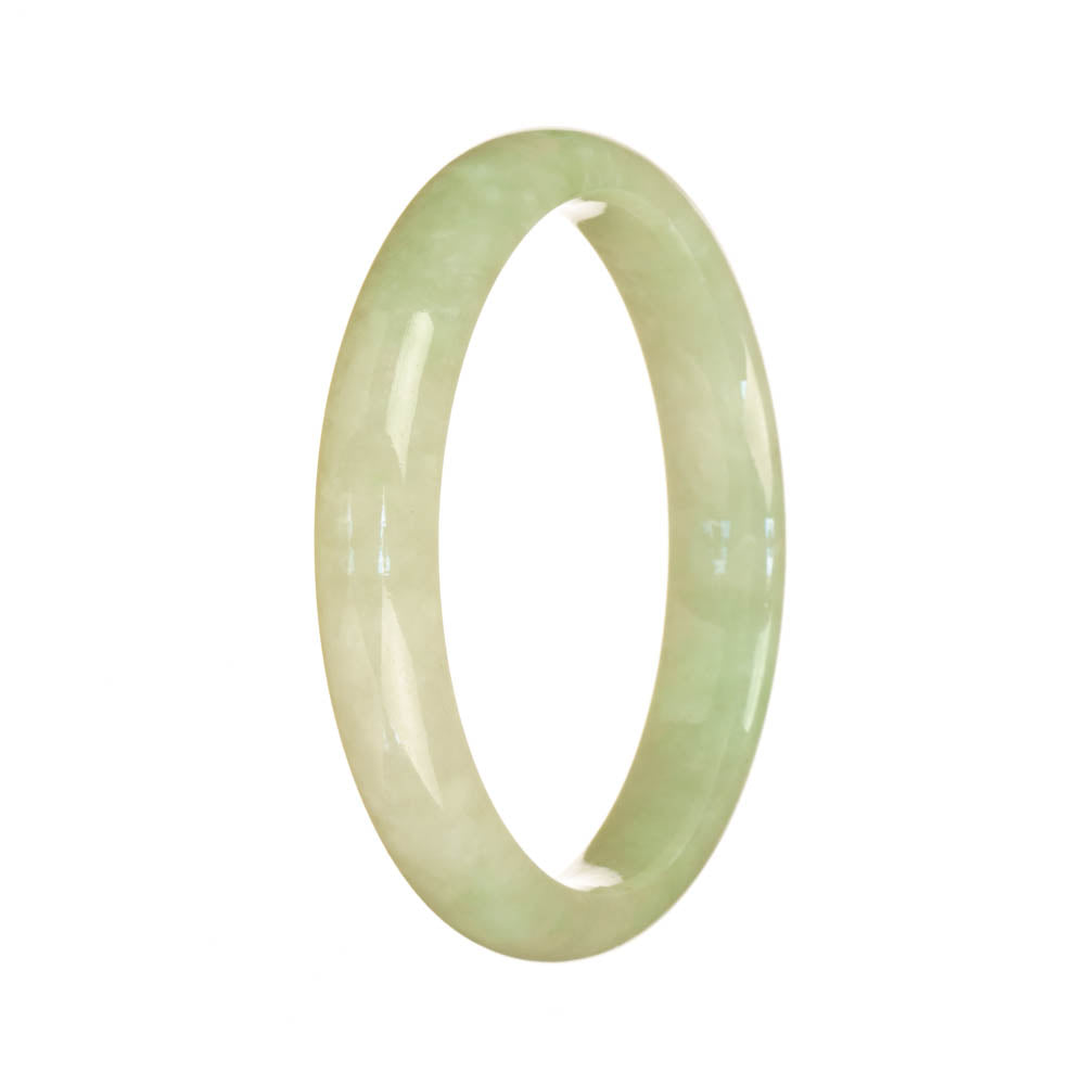 A light green traditional jade bangle in the shape of a half moon, measuring 57mm in diameter. It is made of high-quality jade and has a smooth, polished surface. The bangle is from the brand MAYS, known for their authentic and beautifully crafted jade jewelry.