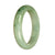 A light green Burmese Jade bracelet featuring a genuine Grade A half moon pattern.