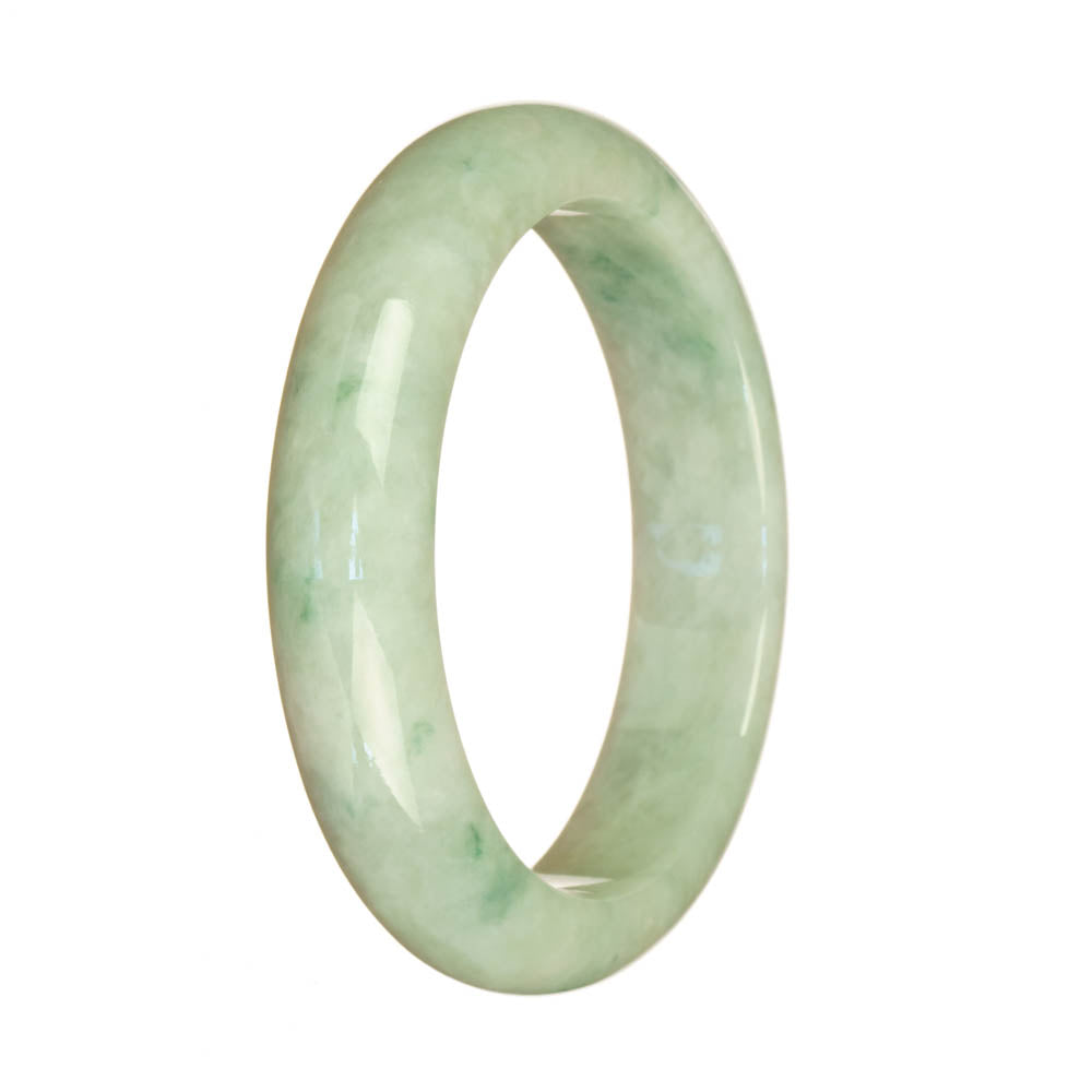 A beautiful traditional jade bracelet with a white base and green pattern. It features a half moon design and is made with genuine Type A jade. Perfect for adding a touch of elegance to any outfit.