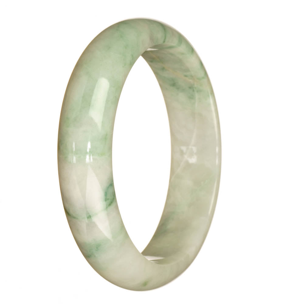 A close-up image of a beautiful jadeite bracelet, featuring a white with green pattern half-moon shaped stone in the center.