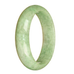 A light green jade bangle bracelet with a half-moon shape, made from high-quality grade A traditional jade.