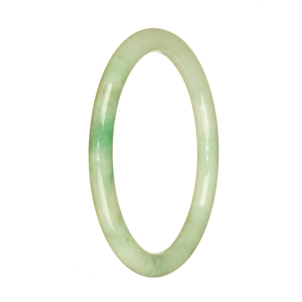 An exquisite light green jade bangle bracelet with a touch of apple green, crafted from genuine Grade A Burmese jade. This petite round 60mm bracelet is a stunning addition to any jewelry collection.