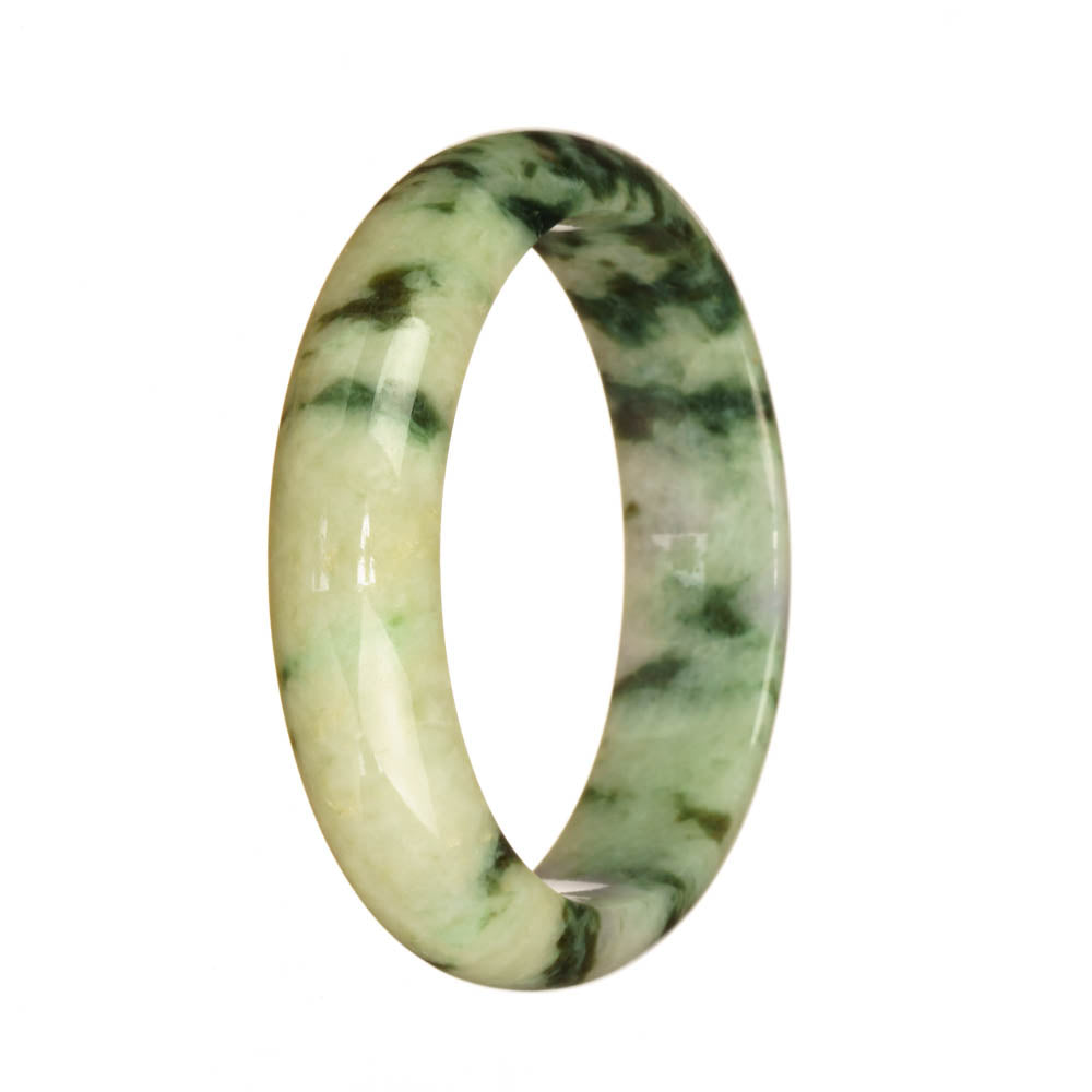 A half moon-shaped Burmese jade bangle in light green and green patterns.