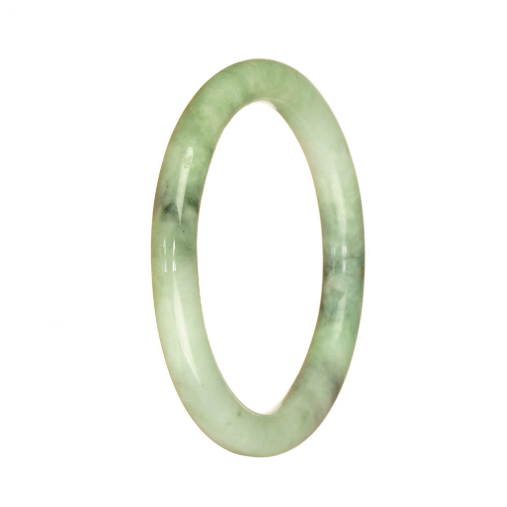 A beautiful light green Burmese jade bangle bracelet with a petite round shape, featuring a genuine Type A jade pattern.