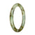 A petite round Burmese jade bracelet featuring a certified natural light green and brown pattern.