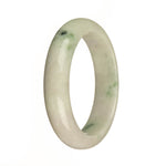 A stunning jade bangle bracelet featuring a combination of Grade A white, apple green, and dark green spots, with a half moon shape. Perfect for adding a touch of elegance to any outfit.