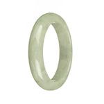 A light green traditional jade bangle with a half moon design, measuring 55mm.