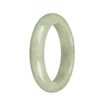 A close-up photo of a light green jadeite jade bracelet in the shape of a half moon. The jade is untreated and certified, showcasing its natural beauty. The bracelet measures 55mm in diameter and is offered by MAYS.