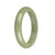 A close-up image of a beautiful green jade bangle bracelet with a half-moon shape. The bracelet is made of high-quality authentic grade A jade, showcasing its traditional and elegant design. The size of the bracelet is 58mm, making it a perfect fit for most wrists. This jade bangle bracelet is a timeless piece that adds a touch of sophistication to any outfit.