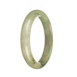 Close-up of a beautiful, high-quality Burma Jade Bracelet with a half moon shape. The bracelet features a combination of white, apple green, and dark green patterns, creating a stunning and unique design. Crafted with genuine Grade A jade, this bracelet is a perfect accessory to add elegance and style to any outfit.