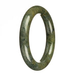 A petite round jade bracelet with a dark green hue and apple green spots.