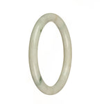 A petite round jade bangle with real natural white color and green patterns. Perfect for adding a touch of elegance to any outfit.