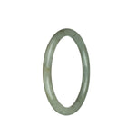 A small, round jade bangle in a delicate pale olive green color.