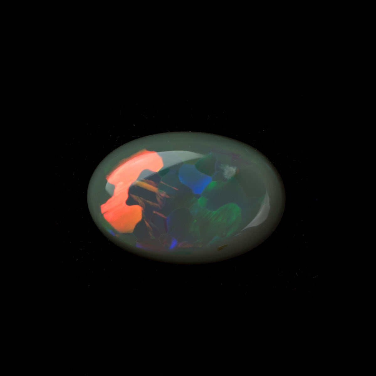 0.77ct Solid Black Opal with Rolling Orange Flashes