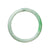 A round green jade bangle bracelet, made with real grade A jade. Measures 63mm in diameter. Sold by MAYS GEMS.
