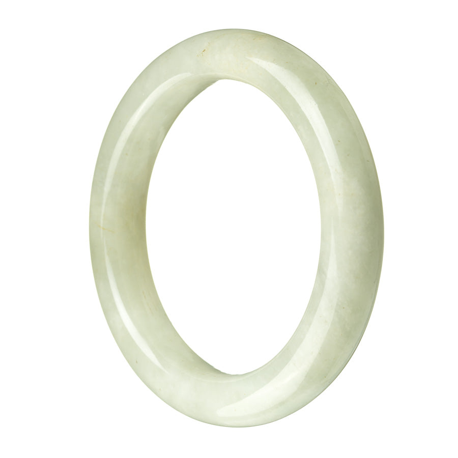 A pale green Burma Jade bangle, 60mm in diameter, with a semi-round shape. This authentic Grade A jade bracelet is a stunning piece from MAYS™.