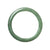 A beautiful green jadeite bangle bracelet with a semi-round shape, measuring 59mm. Perfect for adding a touch of elegance to any outfit.
