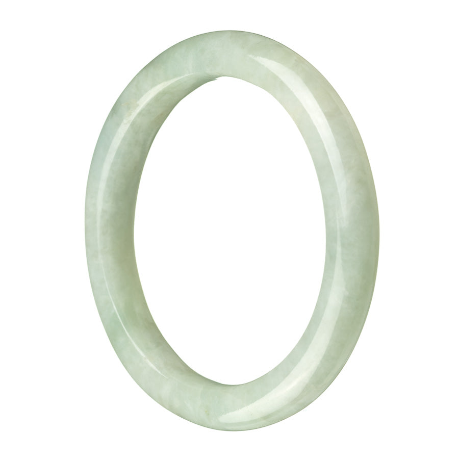 A pale green Burmese jade bangle bracelet with a semi-round shape, showcasing the natural beauty of the stone.