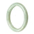A light green jadeite bracelet with a round shape, measuring 63mm.