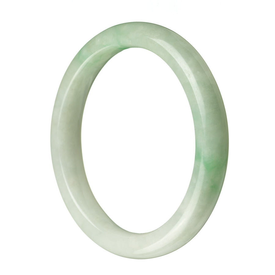 A close-up of a beautiful green Burma jade bracelet with a half moon shape, measuring 63mm. The bracelet is made with genuine grade A jade and is sold by MAYS GEMS.