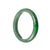 A beautiful green jadeite bangle bracelet with a semi-round shape, measuring 58mm in size. Crafted from genuine Grade A jadeite, this bracelet from MAYS is a stunning accessory.