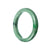 A stunning green jadeite bracelet with a semi-round shape, measuring 56mm. Perfect for adding a touch of elegance and sophistication to any outfit.