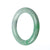 A round, untreated green traditional jade bracelet measuring 58mm in diameter, made by MAYS™.