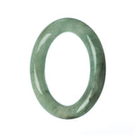 A round, untreated green jadeite bangle, measuring 58mm. A beautiful and authentic piece from Mays Gems.